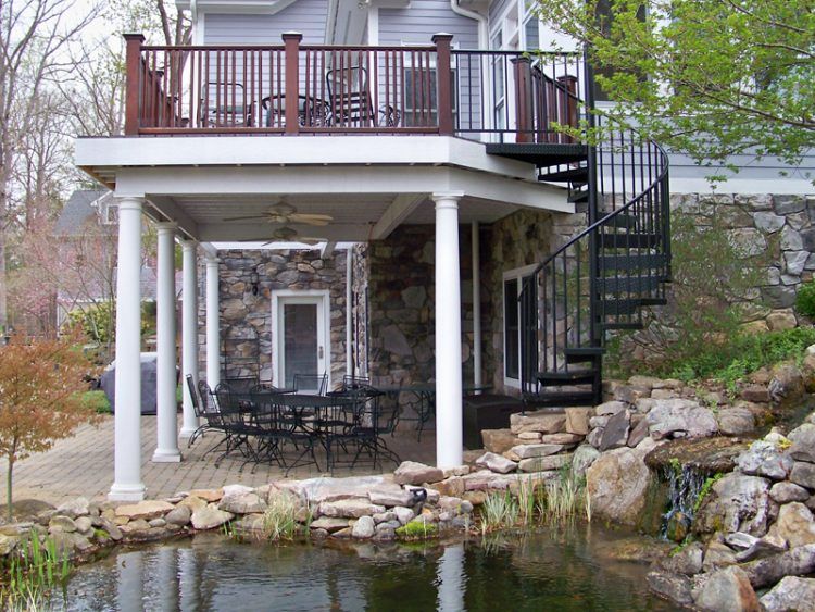 spiral staircase with backyard pond