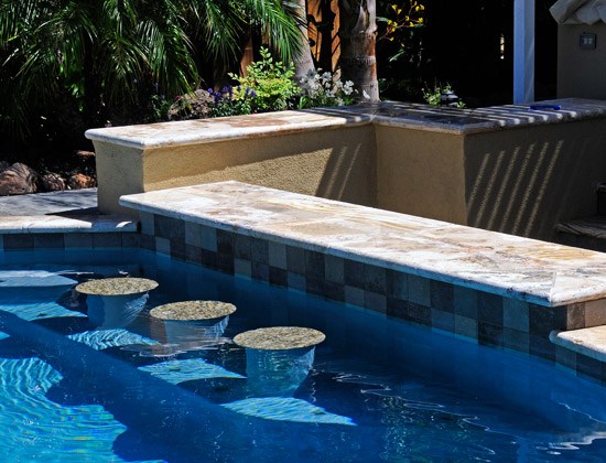 swimming pool with bar stools