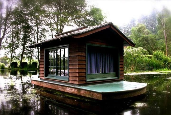 floating tiny home with blue porch