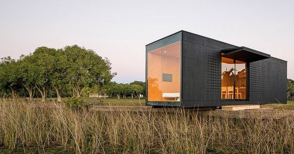 tiny black home with large window