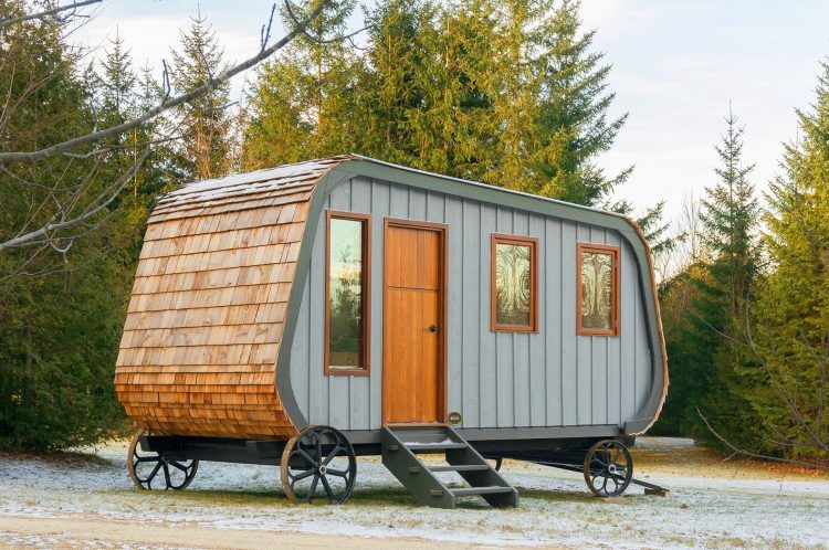 tiny carriage shaped house on wheels