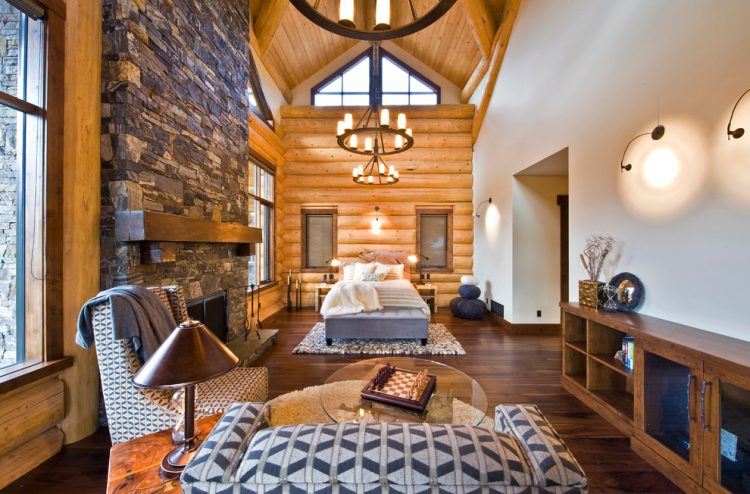 bedroom with beautiful chandelier and fireplace