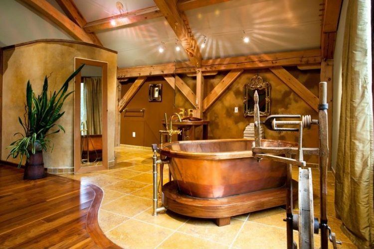 rustic master bathroom with gold tub