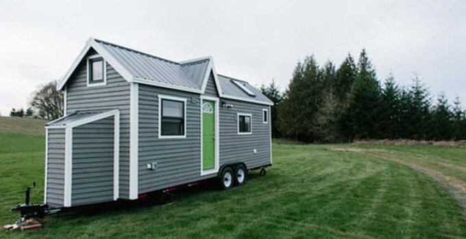 small gray house with lime green door