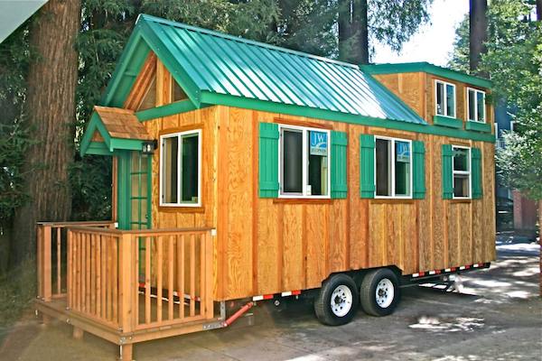 tiny home on wheels with green roof