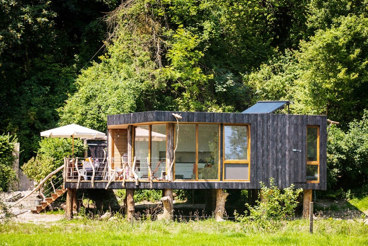 tiny wooden house on stilts