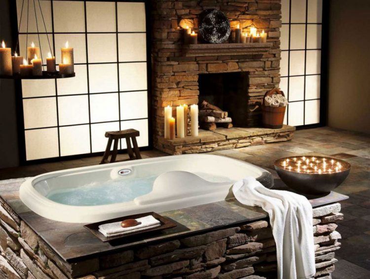 country bathroom with stone fireplace