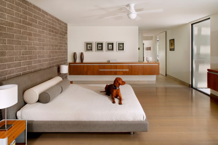 bedroom with brick accent wall