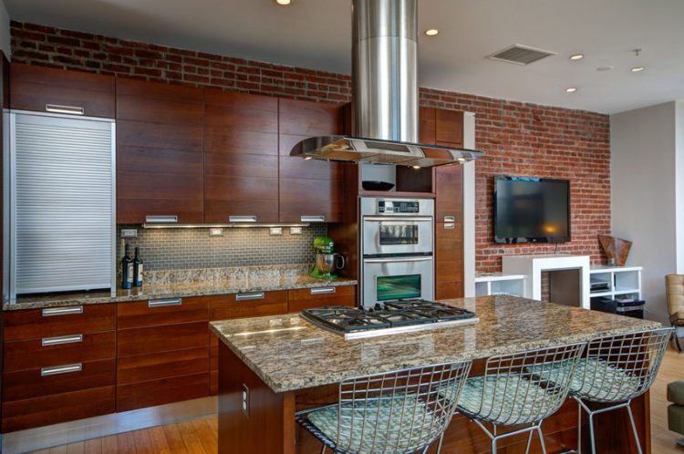 contemporary kitchen with brick wall