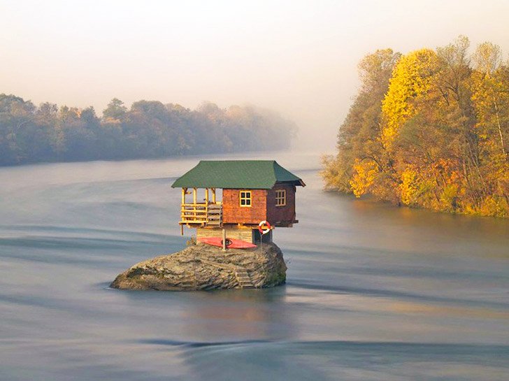 home perched on river