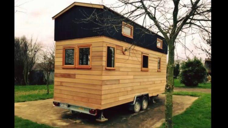 wooden house with black top