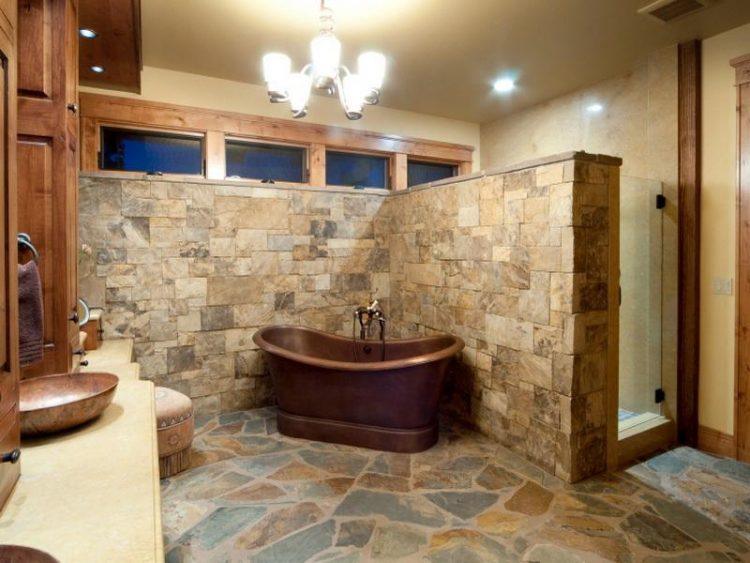 rustic bathroom with stone wall