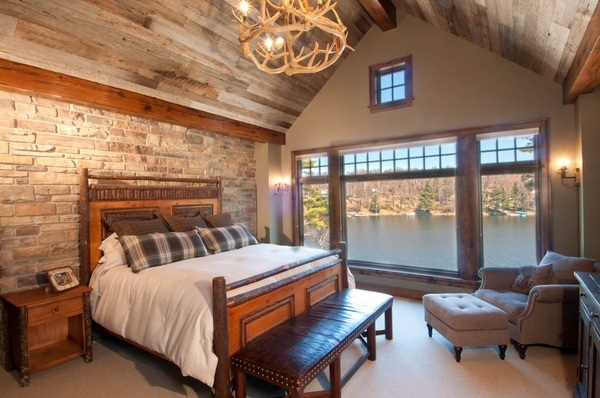 rustic bedroom with brick accent wall