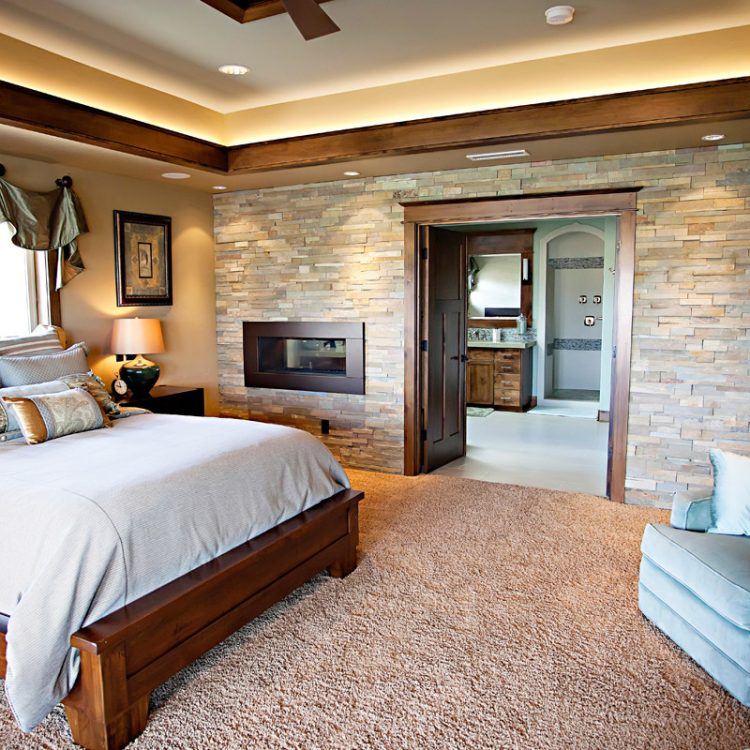 stone electric fireplace in beautiful modern bedroom