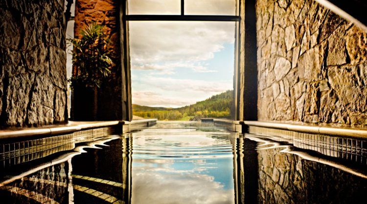 indoor infinity pool going outdoors