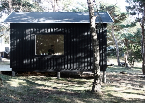 all black mini house on stilts