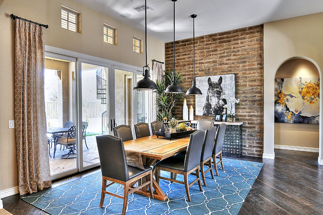 dining room with brick accent wall