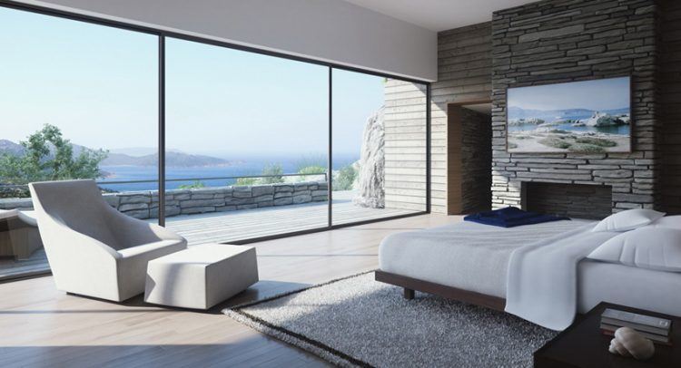 white and stone bedroom with balcony and fireplace