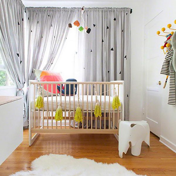 contemporary nursery with wooden crib