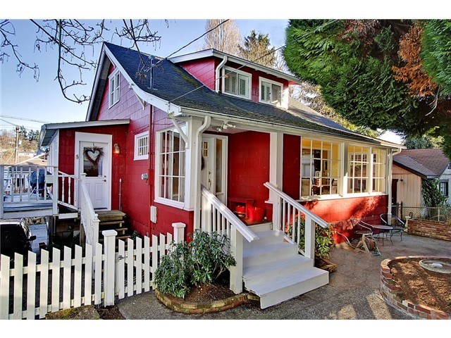 front of beautiful red house in seattle