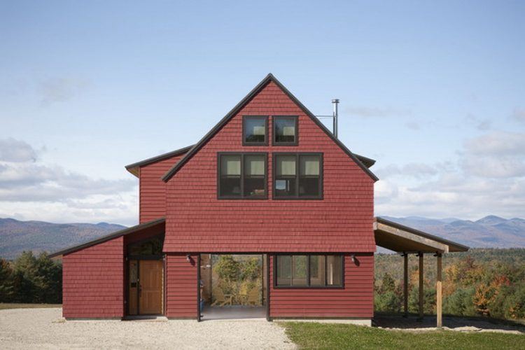 modern two story house with red paint