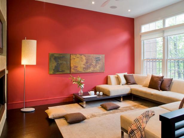 living room with red accent wall