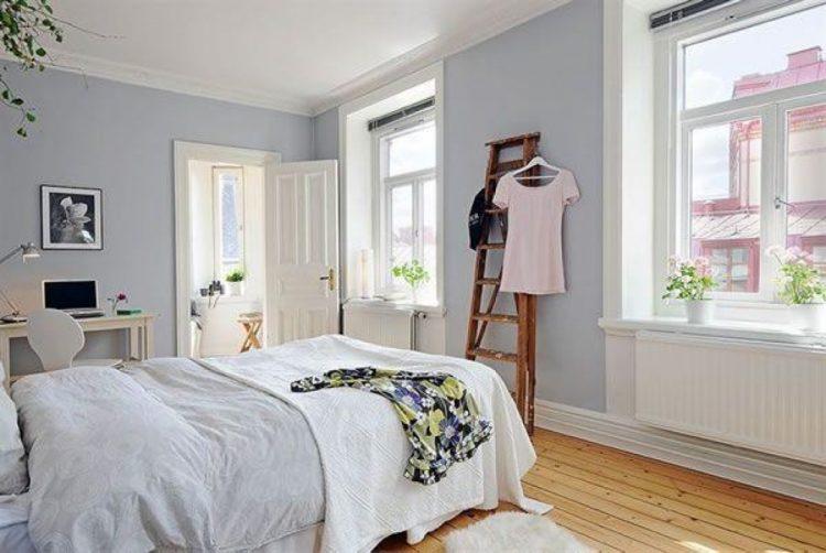 cool blue bedroom with hardwood flooring