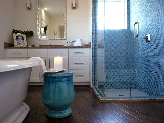 blue bathroom with glass shower