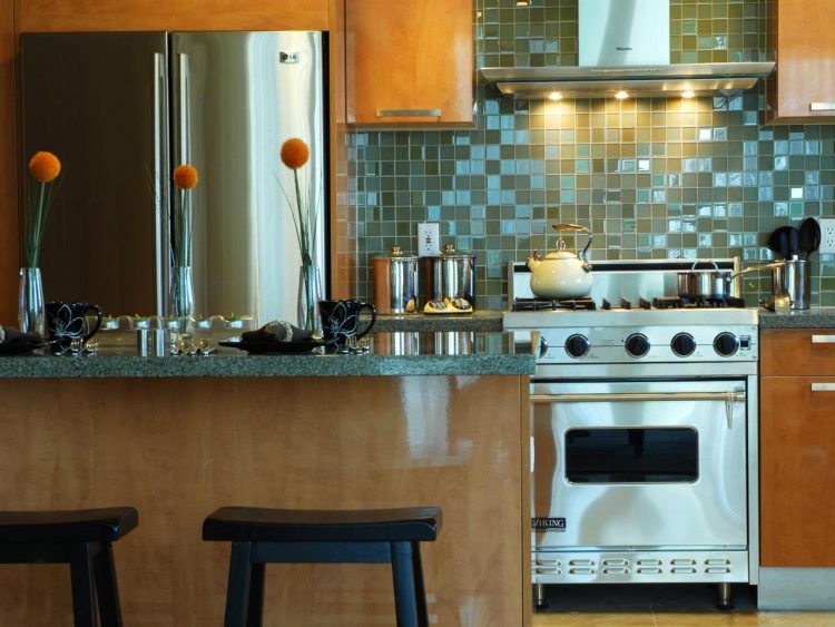 beautiful kitchen with blue backsplash 