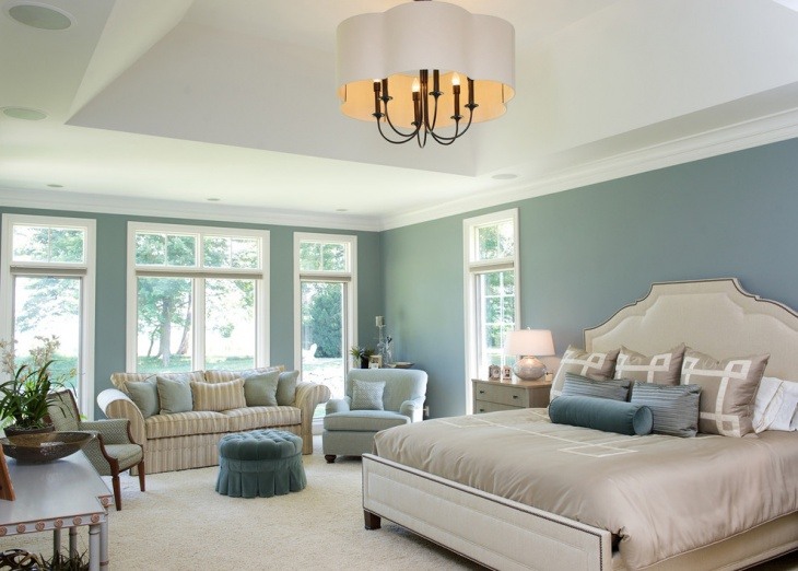 blue bedroom with modern chandelier 