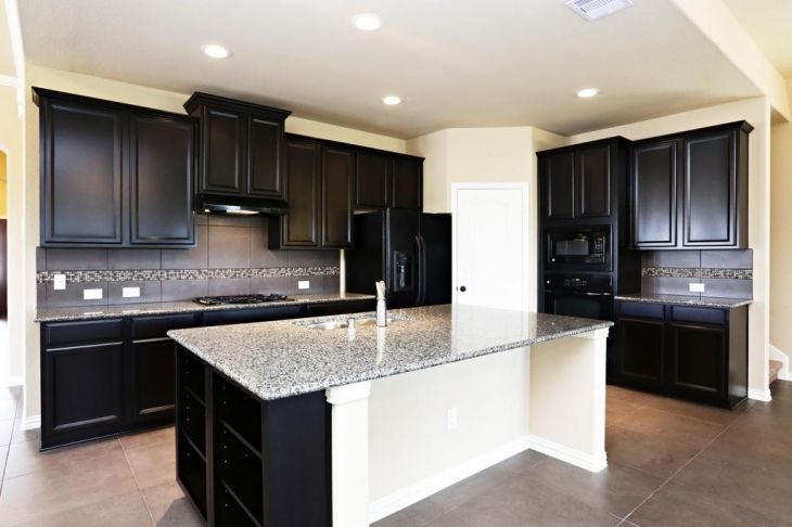 black and white kitchen with granite countertops