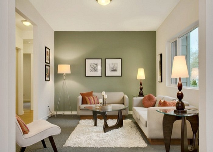 living room with green accent wall