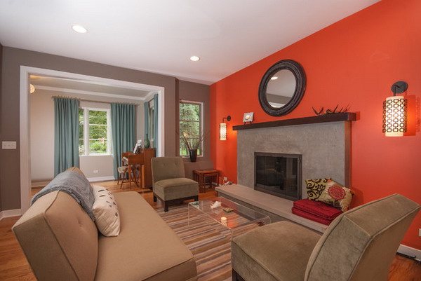 blue living room with orange accent wall