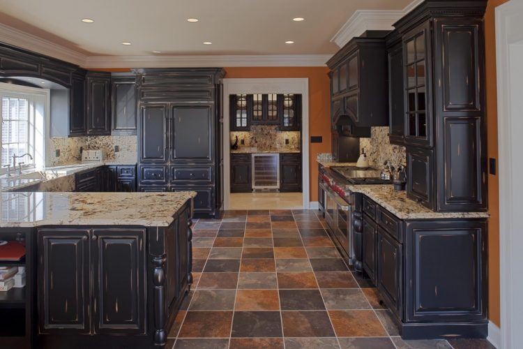 traditional kitchen with distressed black cabinets