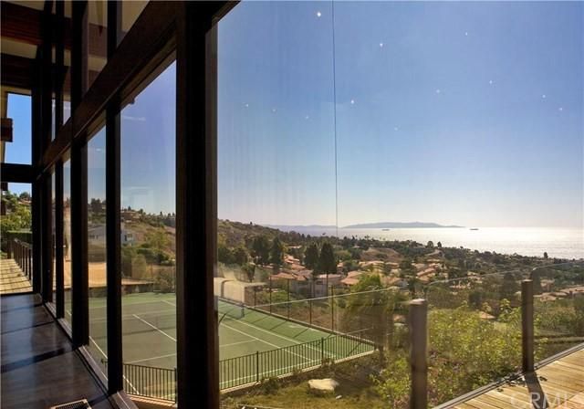 view of tennis court from inside home