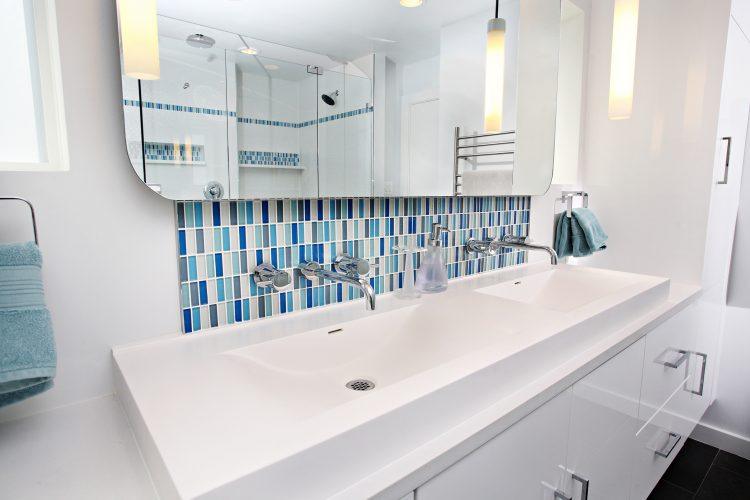 multi colored blue accent tile in bathroom