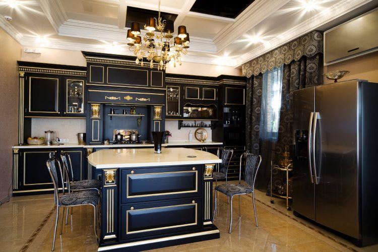 black kitchen cabinets with gold trim