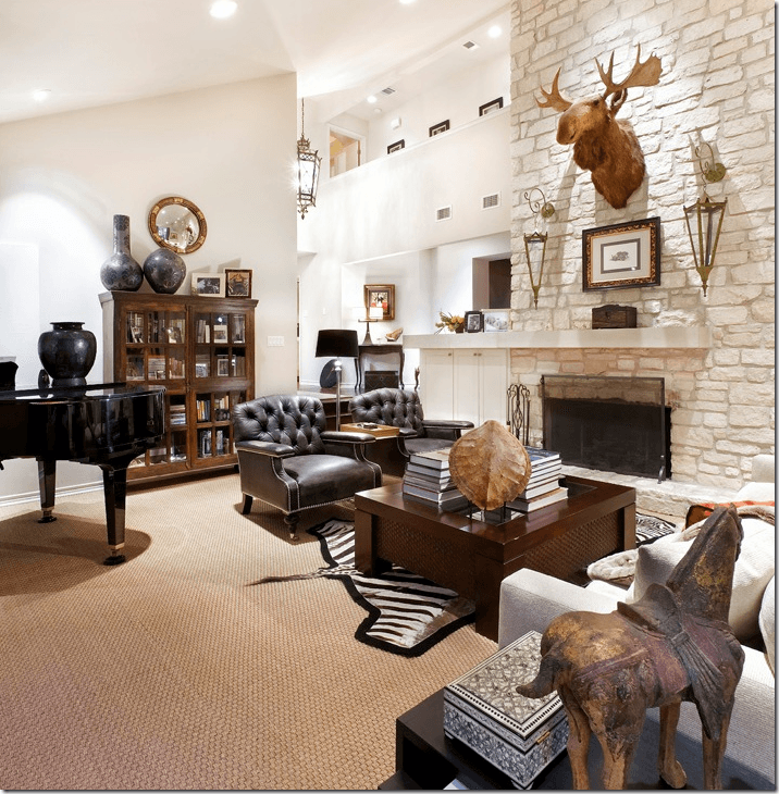 living room with stone fireplace