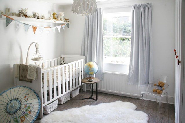 nursery with unique light fixture