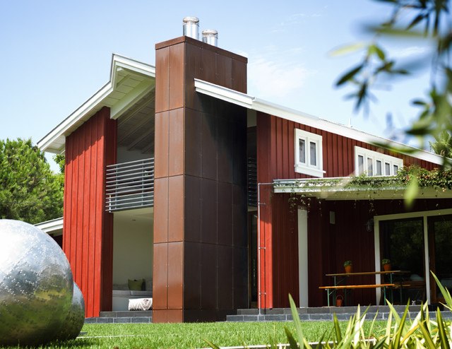 modern barn house with red and brown exterior