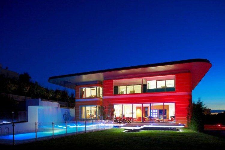 modern red house with swimming pool