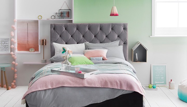 beautiful bed with gray headboard 