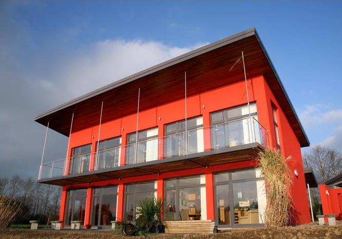 red house with balcony