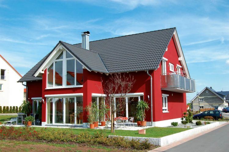 red painted house with white window trim