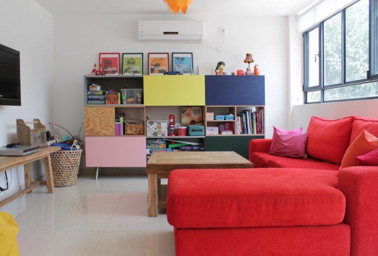 living room with bright red sectional sofa