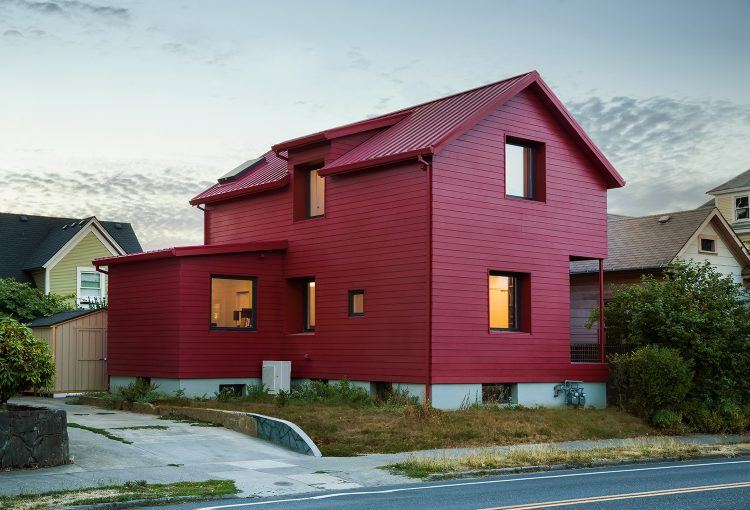 simple red house with traditional design