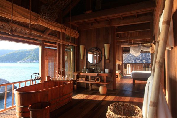 beautiful wooden bathtub with a great view