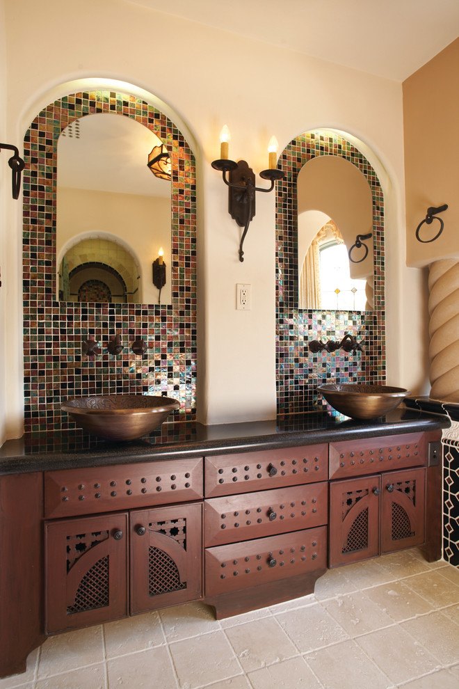 bathroom with double vanity set up and accent tile