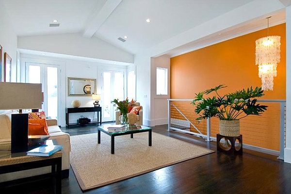 living room with orange accent wall