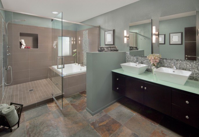 bathroom with large glass shower and tub